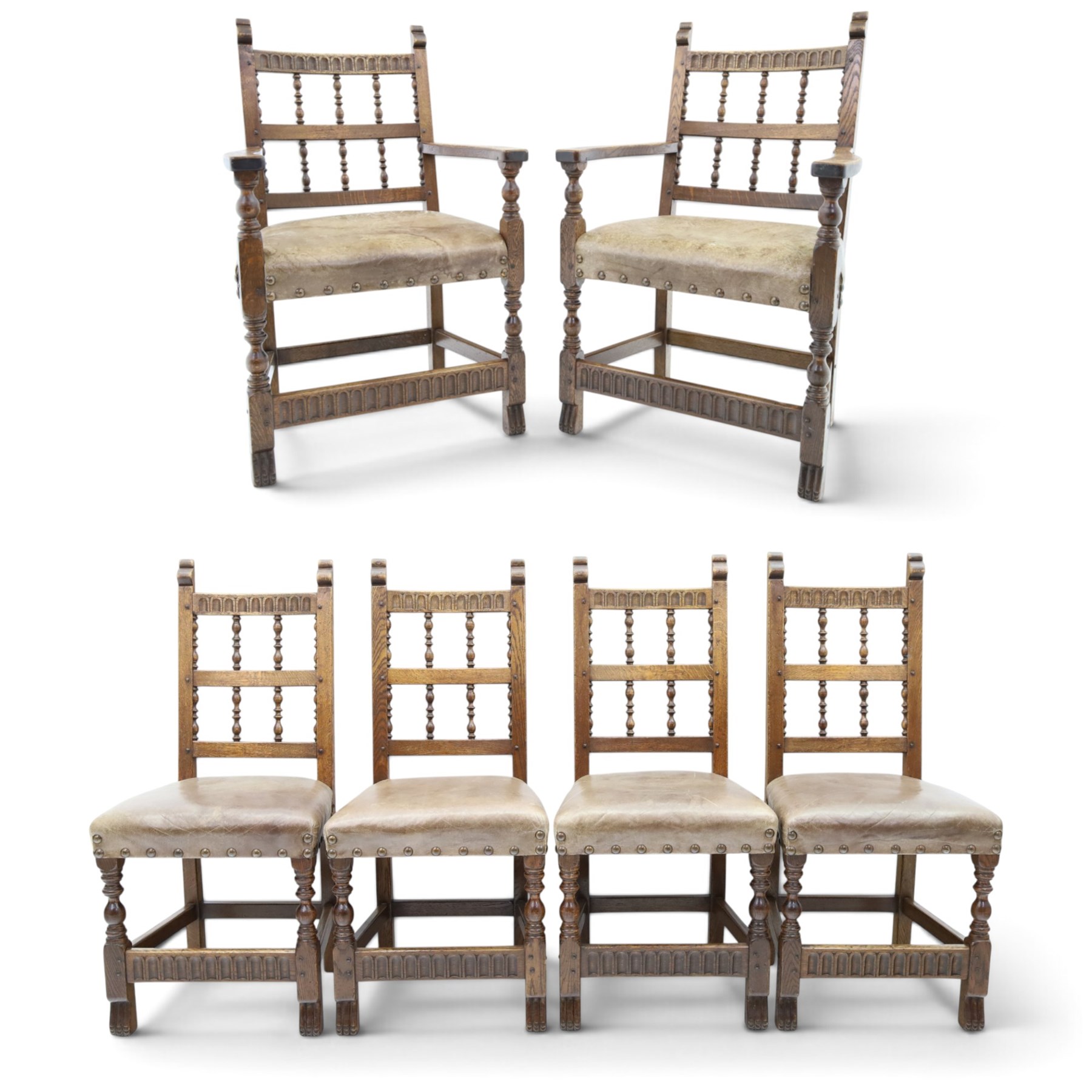 Rupert Griffiths for Monastic Woodcraft - oak 6ft refectory dining table with set six (4+2) matching chairs, rectangular top with arcaded frieze, with trestle base with further arcaded carved stretchers, chairs with carved rails and finials, leather wrapped seats with stud detail, turned supports united by carved stretcher