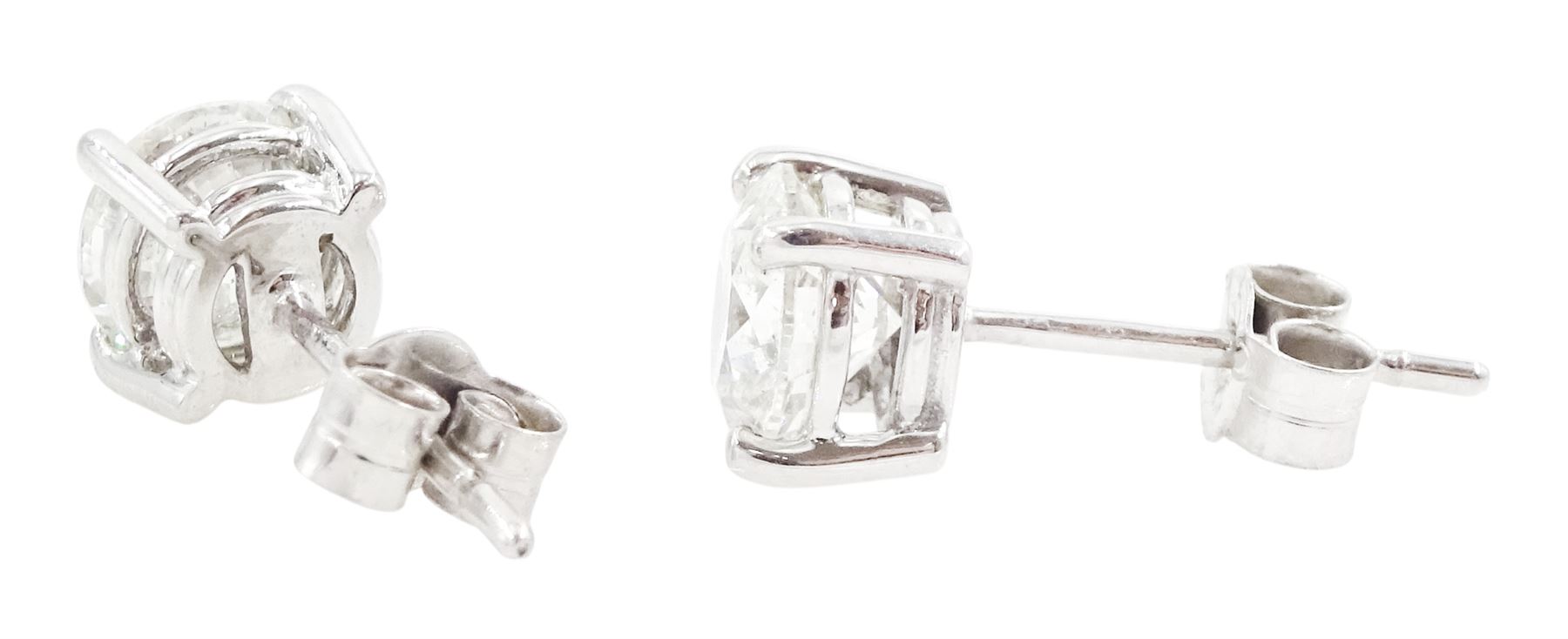 Pair of 18ct white gold round brilliant cut diamond stud earrings, hallmarked, total diamond weight approx 2.05 carat