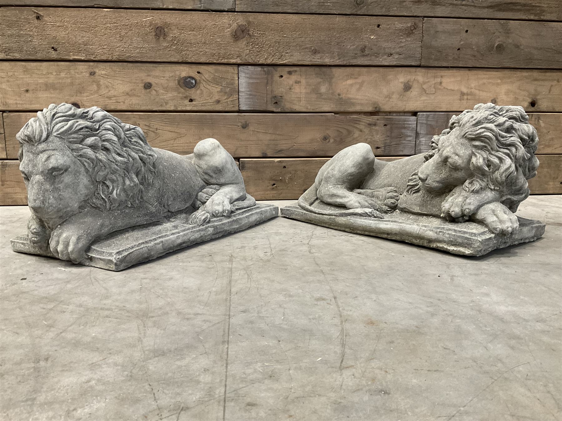 Pair of small recumbent garden lions