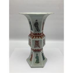 Chinese Kangxi gu vase, of hexagonal form with fluted rim, decorated in polychrome enamels with a male figure to each panel and red character marks to centre, with painted red leaf mark beneath, H32.5cm