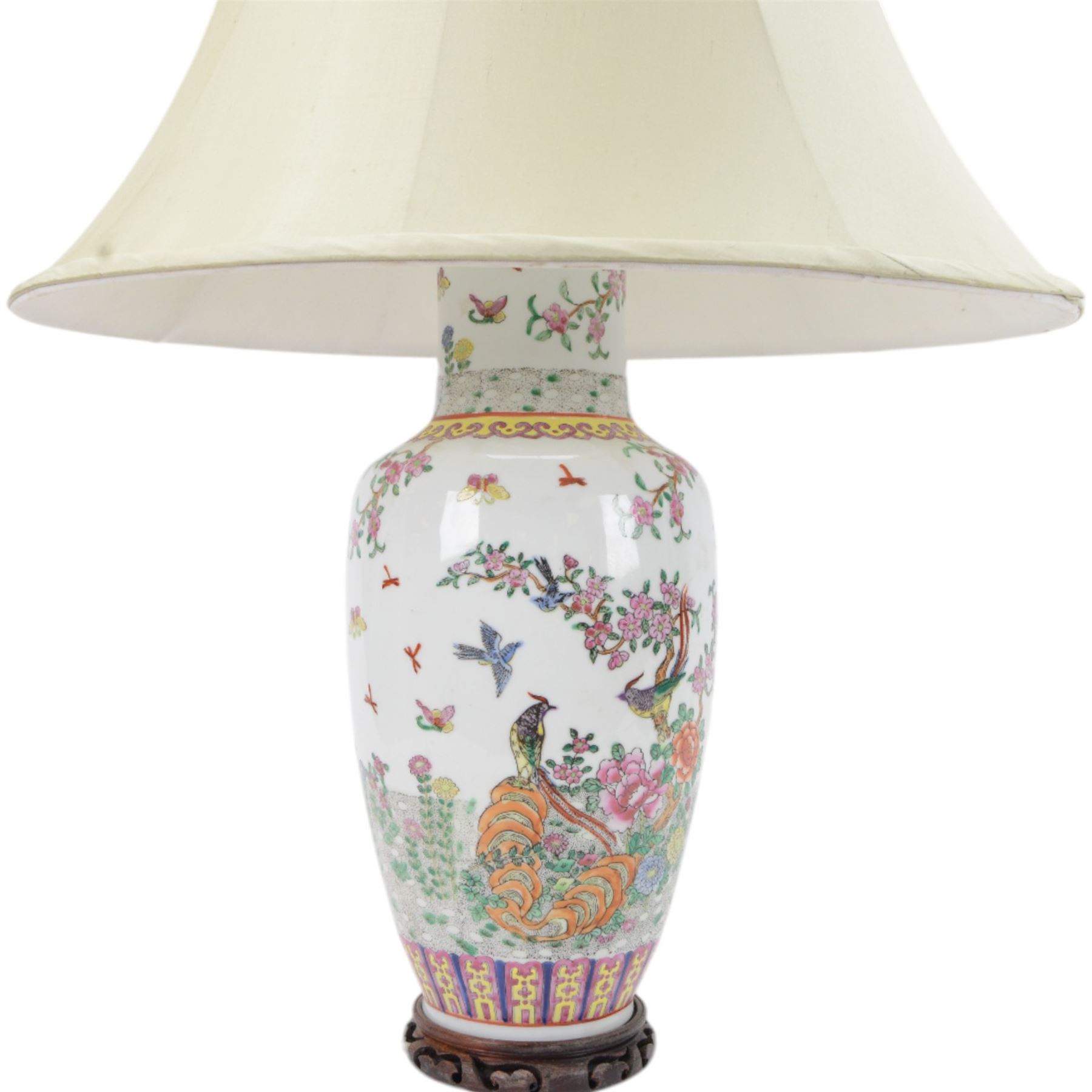 Chinese famille rose table lamp, of baluster form, decorated with birds in blossoming branches, upon a circular wooden base with shade, H78cm