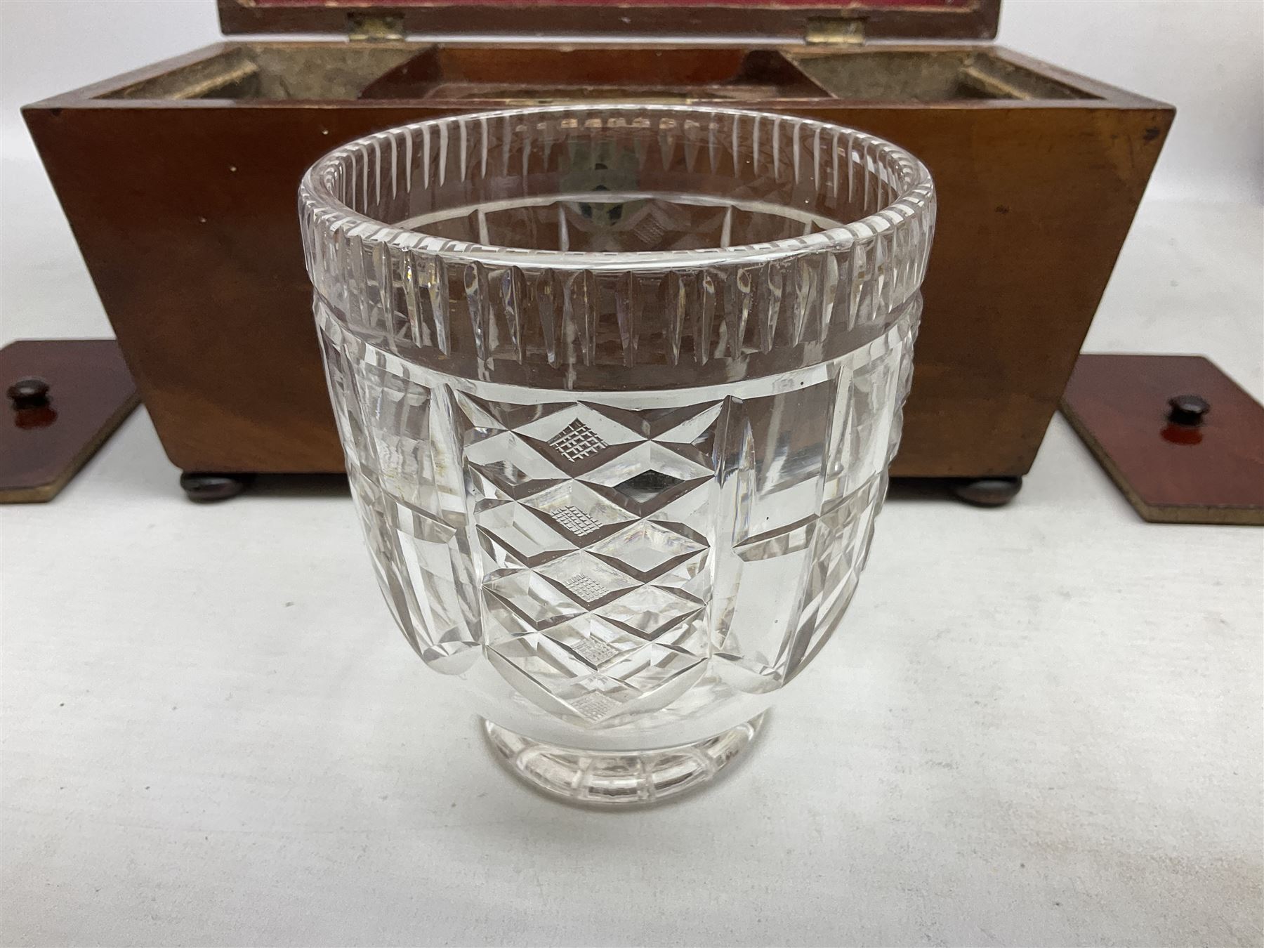 Walnut tea caddy of sarcophagus form, two division lidded interior with a later glass mixing bowl, upon four brass bun feet together with a walnut sewing box with mother of pearl inlaid decoration, tea caddy H16cm