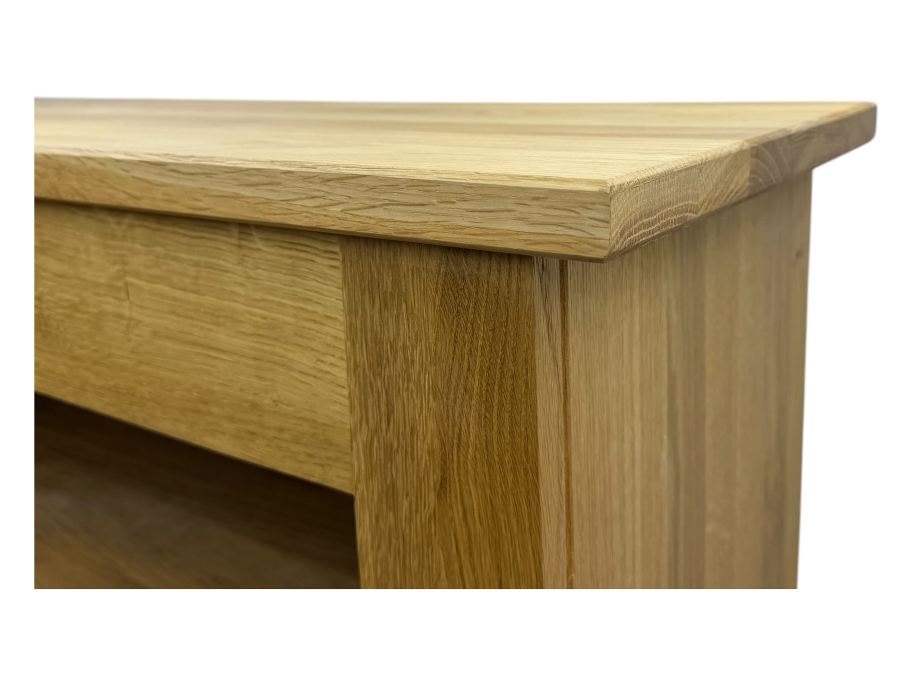 Contemporary light oak open bookcase, rectangular form with projecting top, fitted with five adjustable shelves, on a straight plinth base