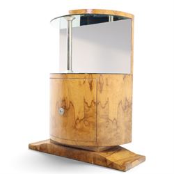 Art Deco figured walnut cocktail cabinet, demi-lune top above mirrored open compartment supported by chrome column, enclosed cupboard below with curved door, on shaped plinth base