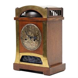 Arts and Crafts oak and brass mounted mantel clock, Hamburg-American Clock Company (HAC), for Liberty & Co, the eight day movement with bell strike, repousse dial with Arabic numerals H36.5cm

  