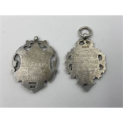 Seven Edwardian and later silver cartouche fobs, to include five gold faced examples and three double sided examples, all hallmarked with various dates and makers

