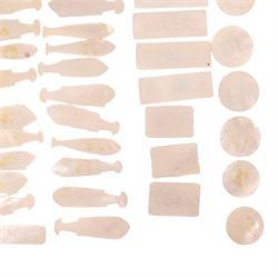 Collection of approximately sixty mother-of-pearl gaming tokens, including fish-shaped, rectangular, circular examples 