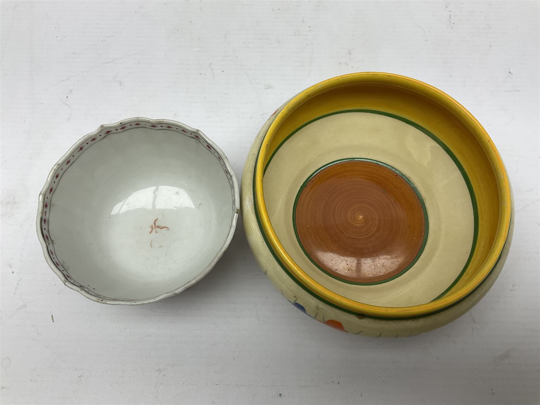 20th century Clarice Cliff Bizarre Crocus pattern bowl, printed marks beneath, D13cm, Staffordshire figure group, and a small tea bowl