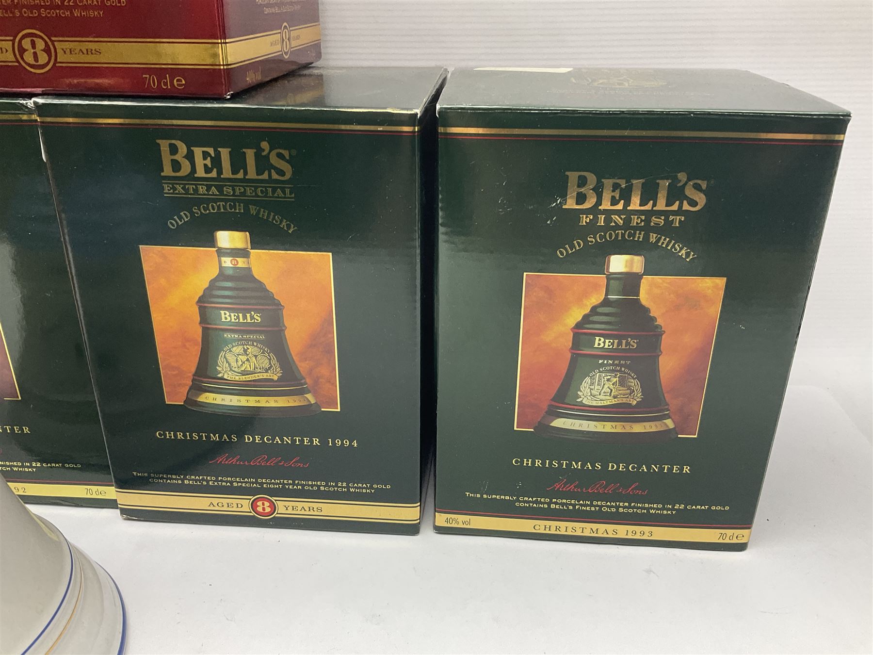 Dimple 15 Year Old Blended Scotch Whisky, together with nine Bells, scotch whisky, in Wade ceramic decanters, including Christmas 1991, 1998, 1996 etc, of various contents and proof 