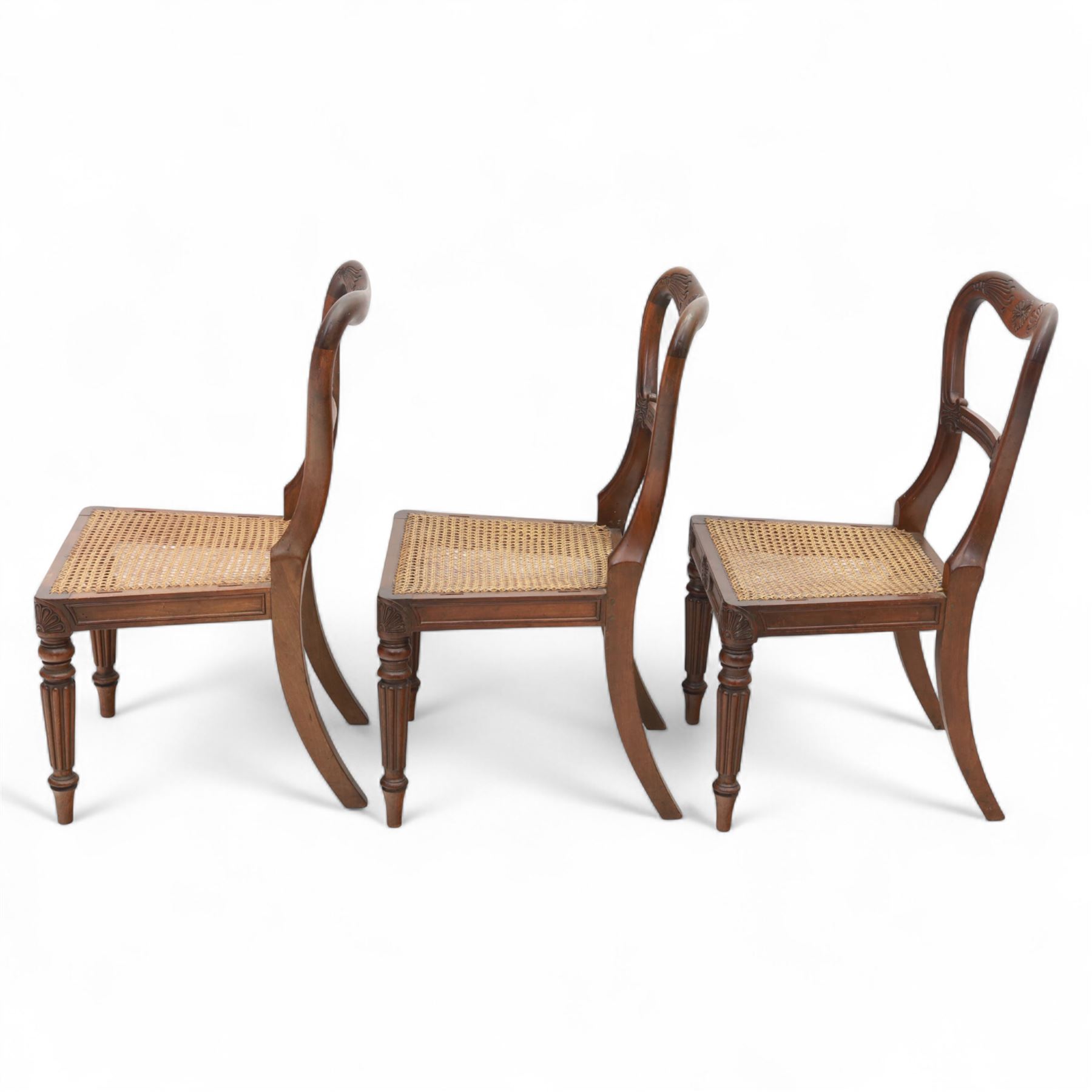 Gillows - Set of six mahogany dining chairs, each with curved top rail carved with floral medallion and scroll detail, fluted front supports, caned seats, the seat rail underside stamped HH identified as H. Howse an apprentice cabinetmaker at Gillows.