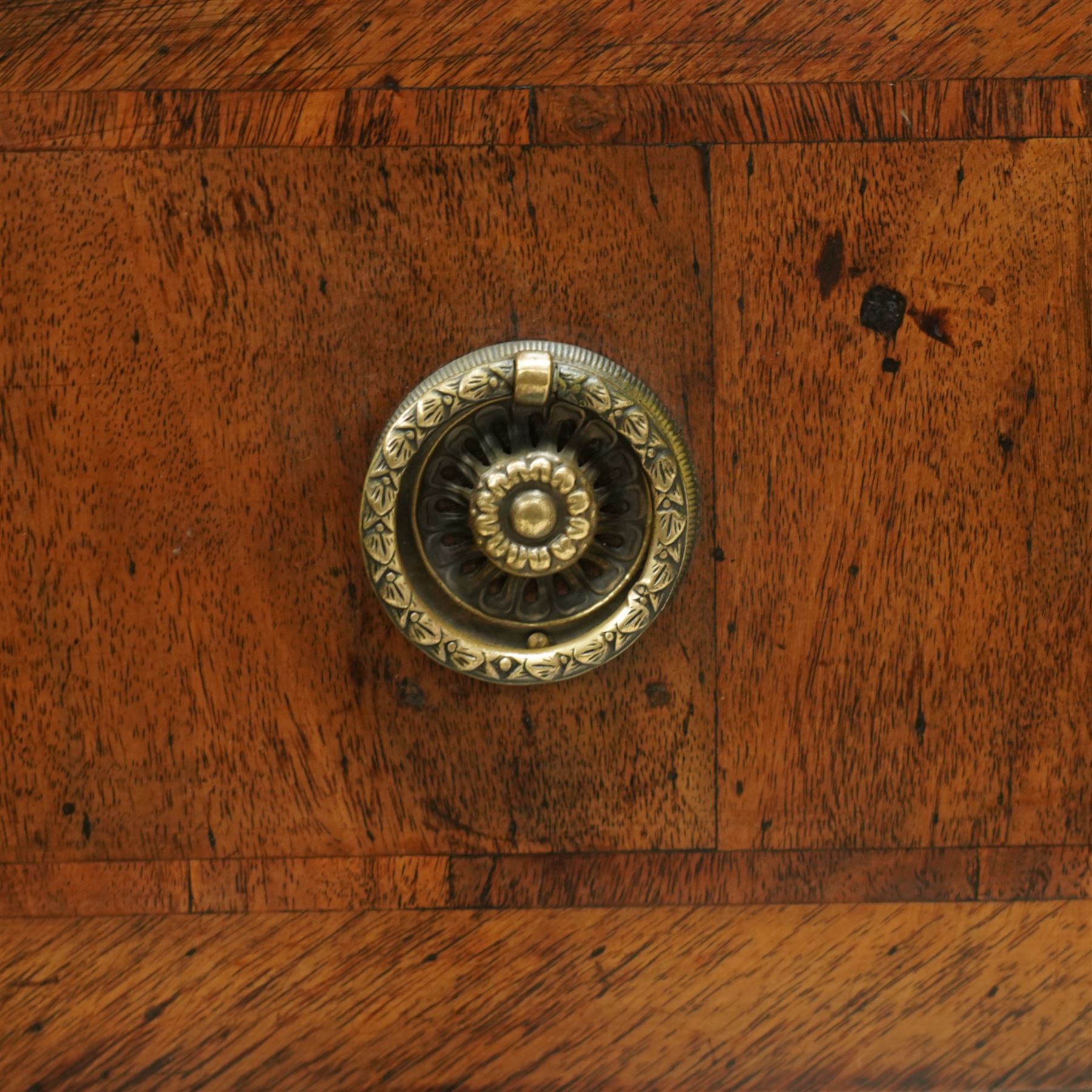 Large 18th-century North Italian walnut commode, rectangular top with quartered veneer, central parquetry inlay and raised moulded edges above three drawers with brass ring handles, cross banding and further central parquetry inlay, supported on square tapered feet