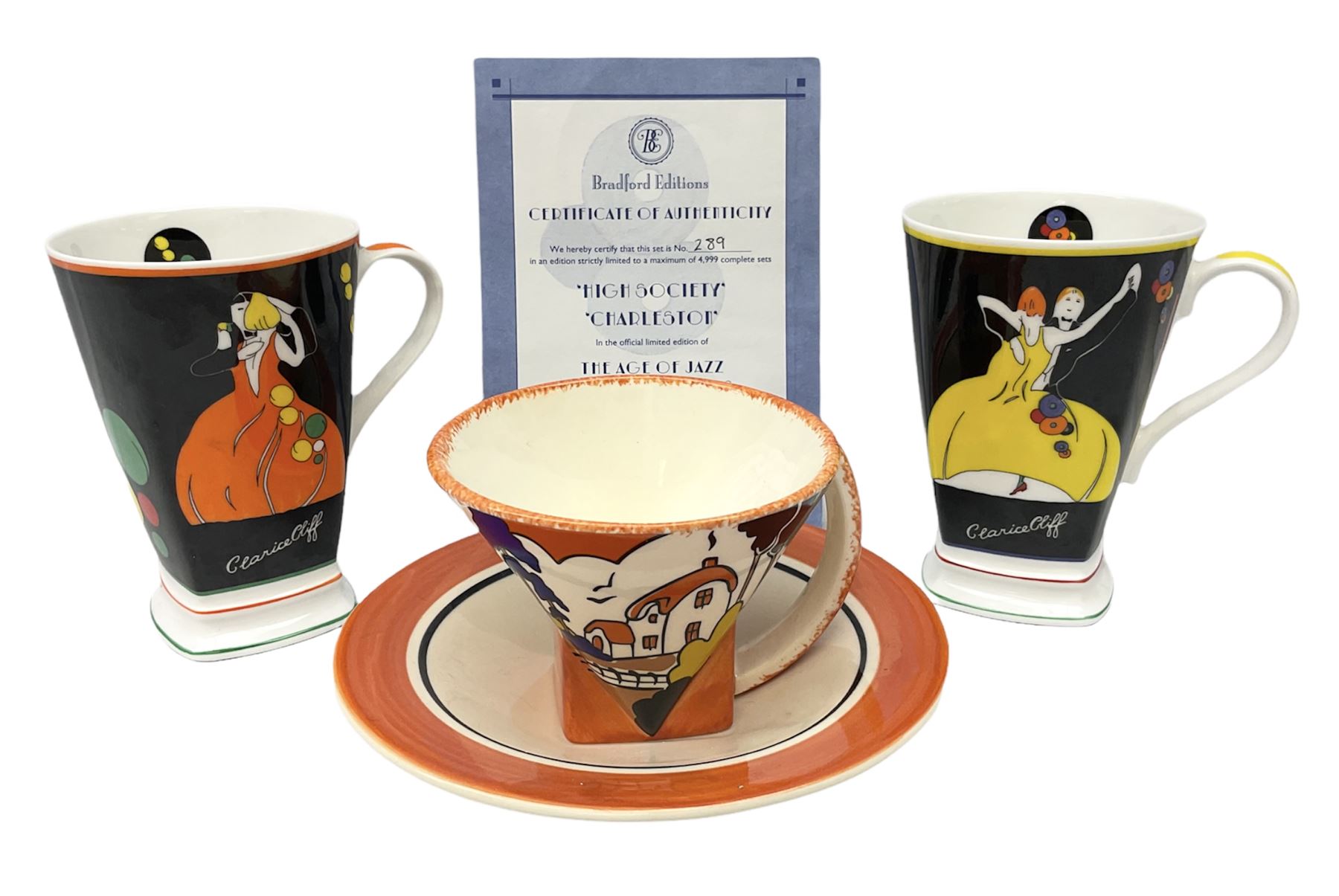 Two limited edition Bradford Exhange Clarice Cliff Age of Jazz beakers, no 289/4,999, with certificate, in box, together with a Moorland Art Deco Clarice Cliff style Huntley Cottage pattern teacup and saucer 
