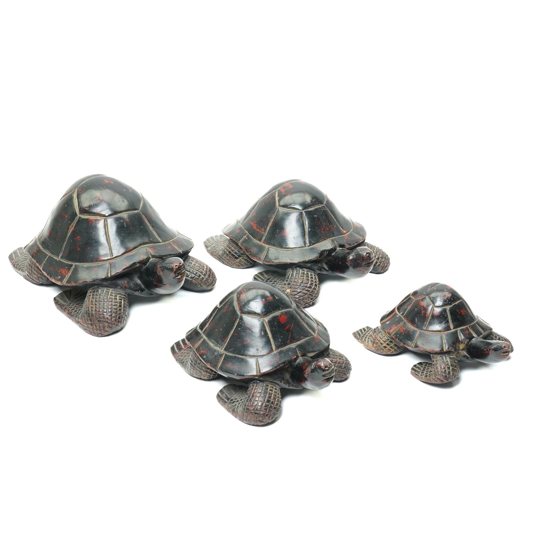 Set of four Asian carved and lacquered graduated ornamental turtles, largest L30cm