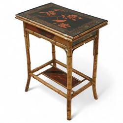 Late Victorian bamboo and lacquered card table, the top decorated with birds and floral sprays, hinged to reveal a baize playing surface, on bamboo effect legs with lacquered undertier