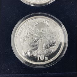 Four one ounce fine silver coins, forming 'The 2005 Famous World Silver Coin Collection', comprising United States eagle, Australian kangaroo, Chinese panda and Canadian maple leaf, cased with Westminster certificate 