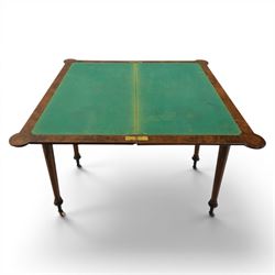 Victorian walnut card table, hinged rectangular moulded top with rounded corners and figured veneers, revealing a green baized lined interior, plain frieze with beaded lower edge, raised on ring turned tapering supports terminating in ceramic castors