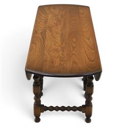 Ercol - elm oval/rectangular drop leaf coffee table, bobbin turned base