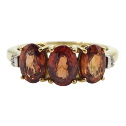 9ct gold three stone oval cognac zircon and baguette chip diamond ring, hallmarked