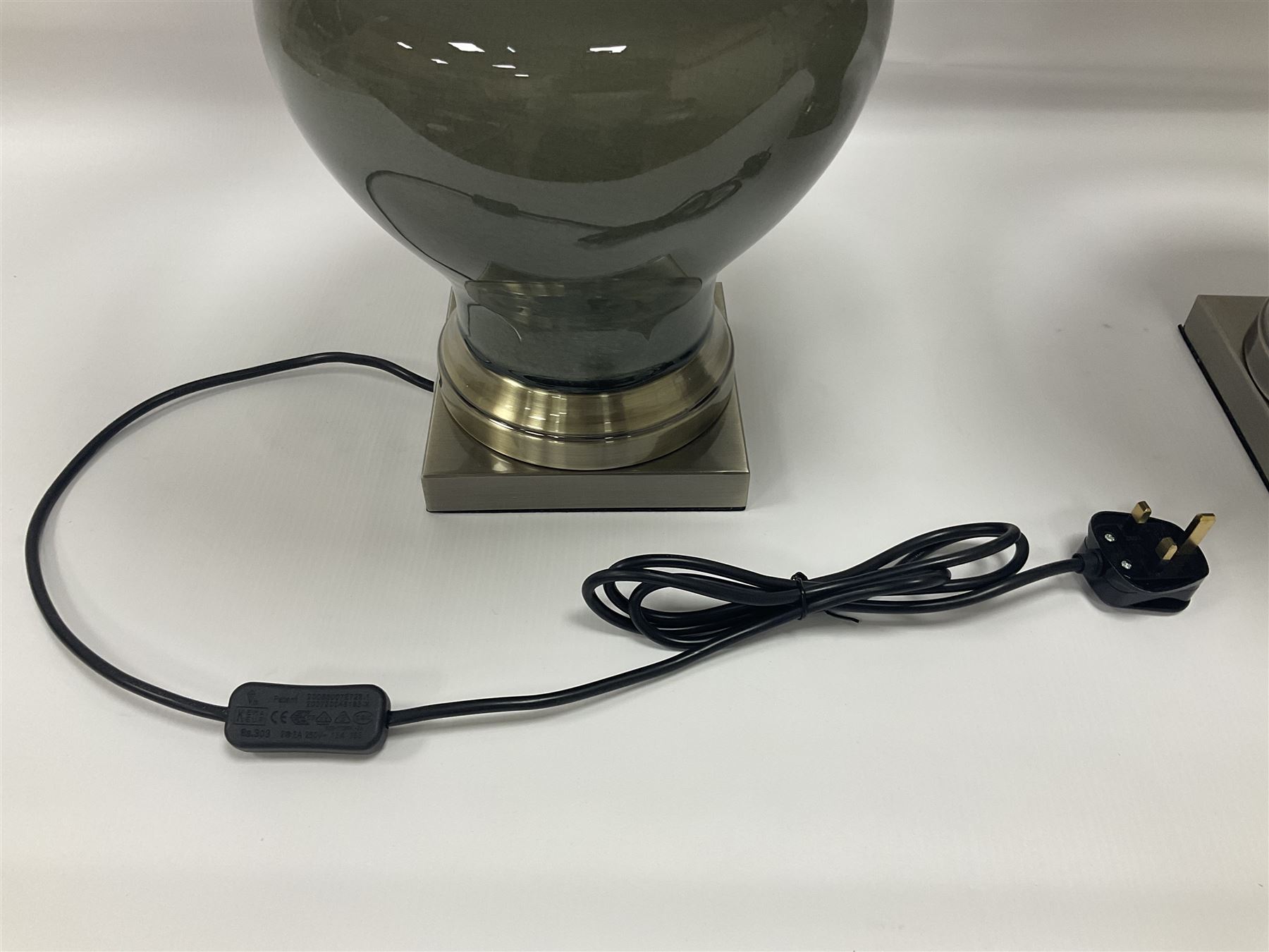 Pair of table lamps of squat baluster form, with a crackle glaze to a dark grey ground, upon a square base, including shade H57cm