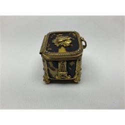 George III tortoiseshell trinket box with initialled panel and studwork decoration to the hinged cover, upon four turned ivory feet, H3cm L6.5cm D3.5cm, together with a Victorian gilt mounted tortoiseshell trinket box, with stylised mounts and musical trophy decoration to the hinged cover, upon four ball feet, H3cm L4cm D3cm, (2)