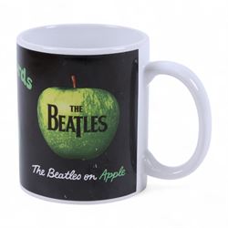 The Beatles memorabilia, including 1964 Fan Club patch, framed with a black and white picture of the band, a further framed black and white picture displayed with Strawberry Fields Forever single, The Beatles Anthology, biographies and other books, two CDs, mug, etc