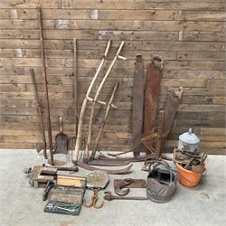 Large quantity of vintage hand tools including scales, scythes, saws etc