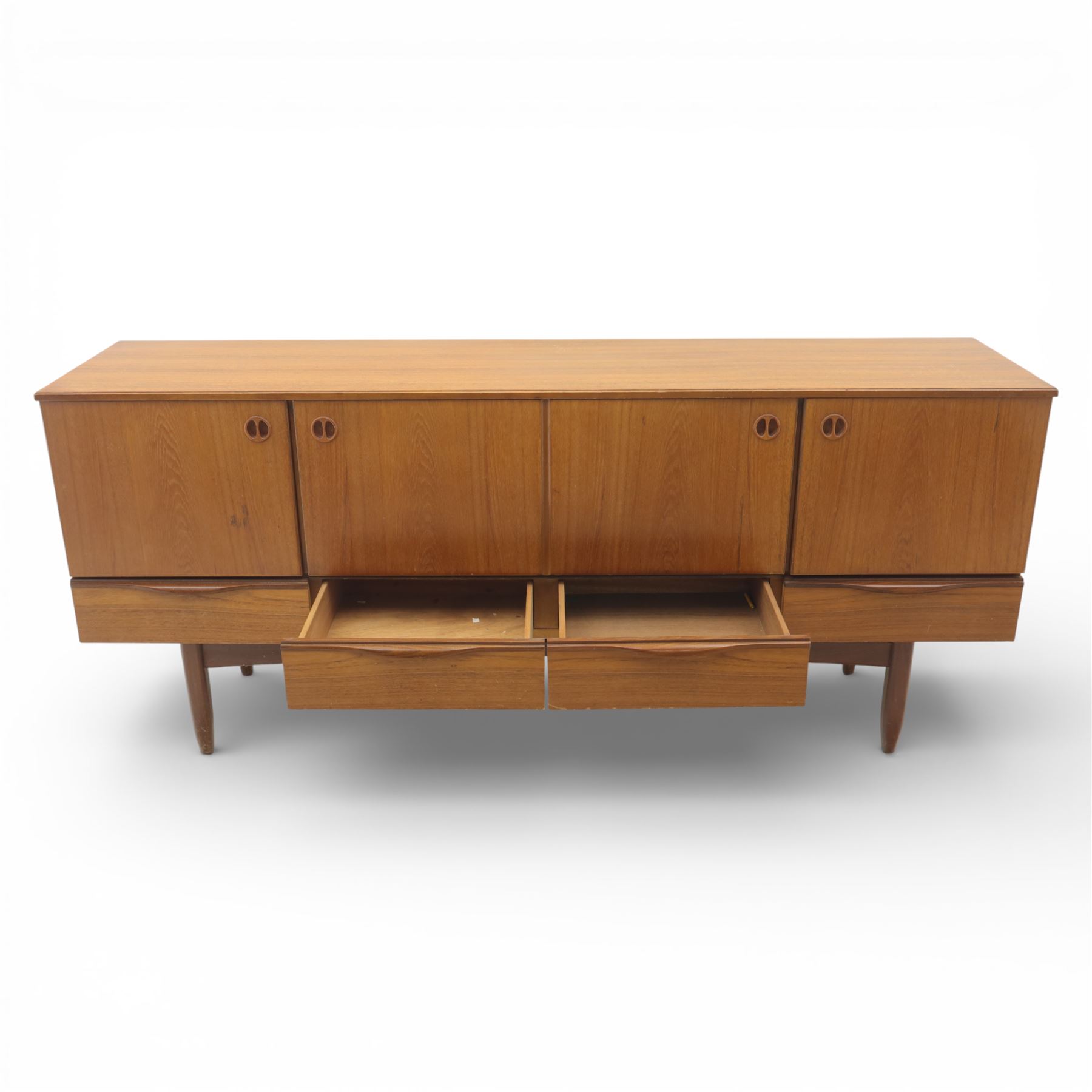 Portwood - Mid 20th century teak sideboard, rectangular top with fall front in the centre flanked by cupboard doors with recessed handles, above four drawers raised on tapered legs