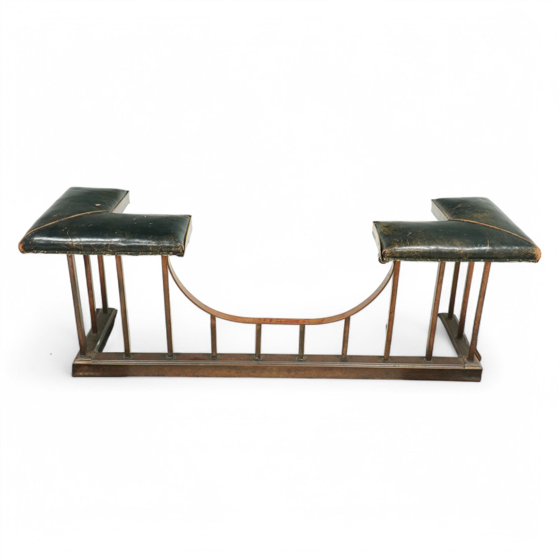 Early 20th century brass and buttoned green leather club fender with plain uprights 