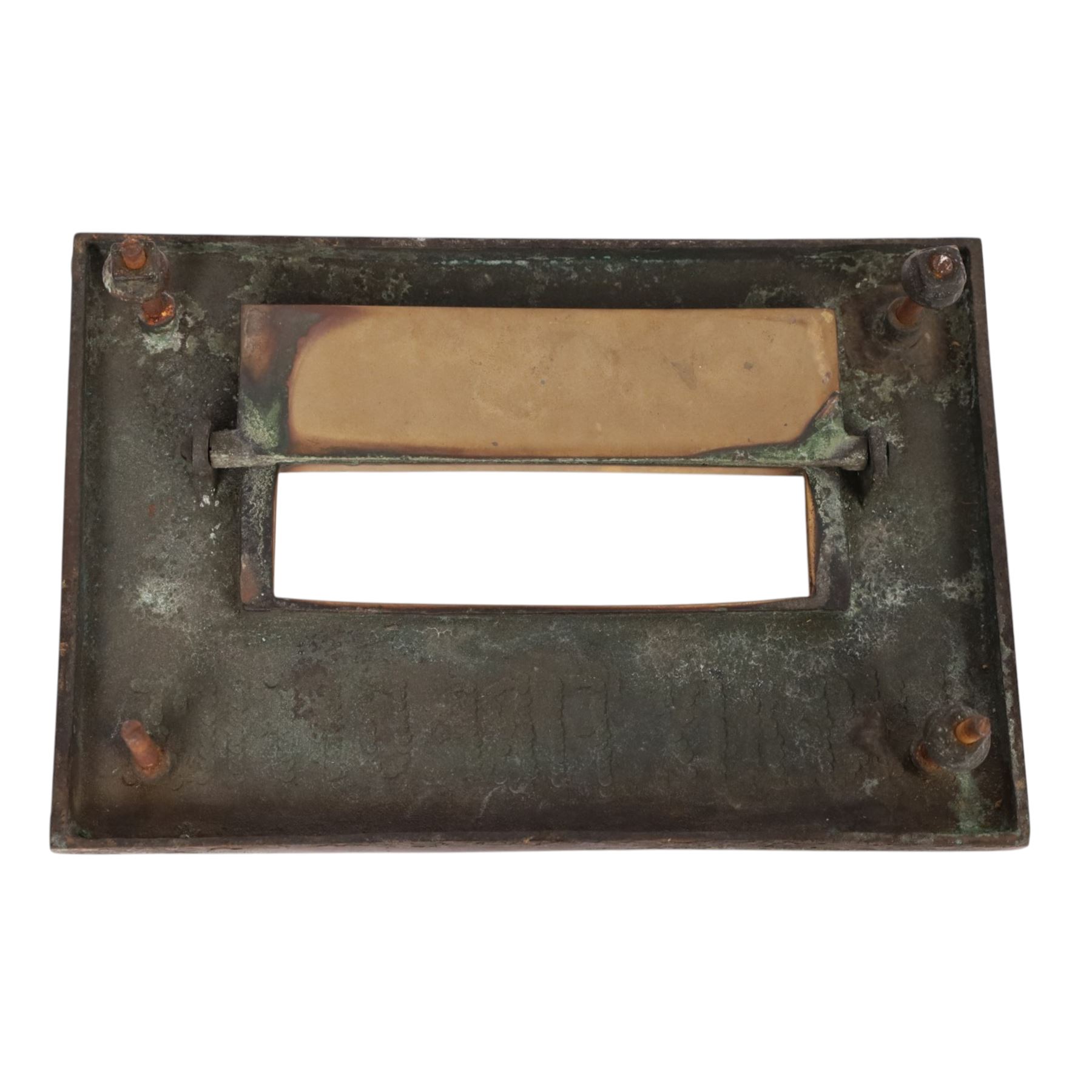 Late 19th century brass door knob set and brass letter box cover for Phoenix Assurance Company Limited, the door knobs each cast with fluted sides, the fronts with deep cast phoenix, square spindle shaft, each approximately L7.5cm, the letter box cover inscribed Phoenix beneath rectangular letter recess and flap, 19cm x 28cm