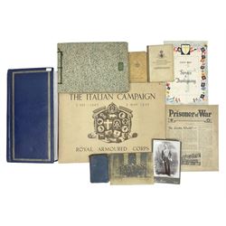 Modern album containing over sixty postcards and photographs including memorial portraits of KIA soldiers, regimental crests, comic, WW1 embroidered silk, uniforms, cap badges, camp and manoeuvre images etc; another personal photograph album of WW2 soldiers relaxing; Royal Armoured Corps booklet 'The Italian Campaign 3rd Sep. 1943 - 2nd May 1945; and other paper ephemera of military interest