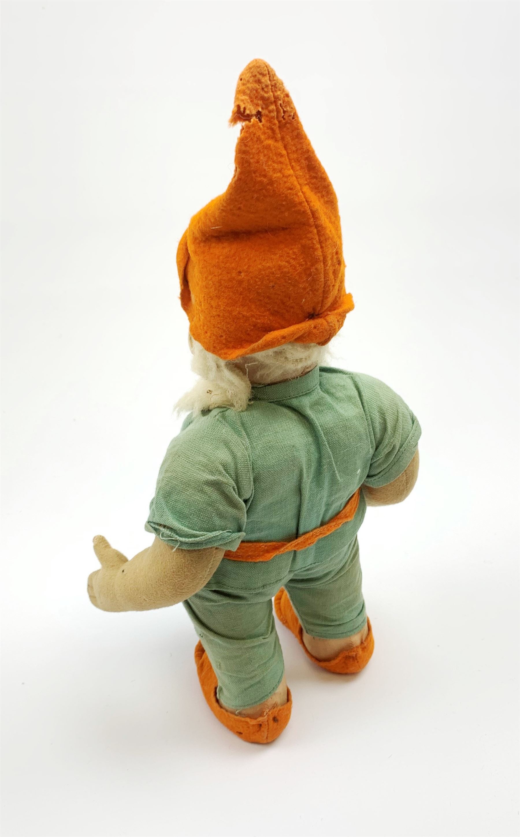 Chad Valley pressed felt figure of the Disney Snow White dwarf 'Doc' with painted facial features, standing wearing a green linen suit with orange hat, belt, buttons and shoes H13