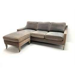 Three seat sofa with reversible chaise corner piece, upholstered in studded grey velvet