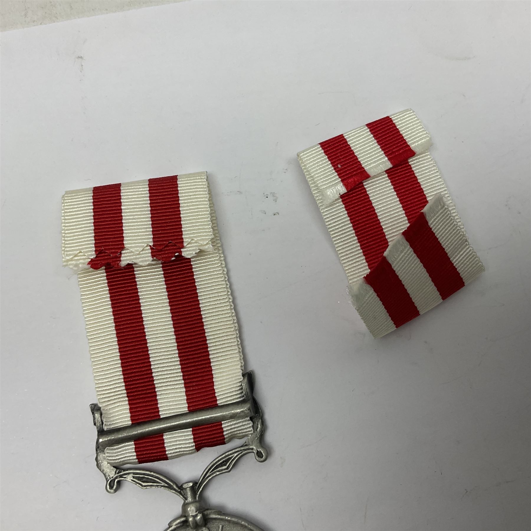 Victoria Long Service in the Volunteer Force Medal awarded to 369 Bombr. W. Woodward 1st Lincs. V.A.; and reproduction Victoria India Medal with Lucknow clasp; both with ribbons (2)