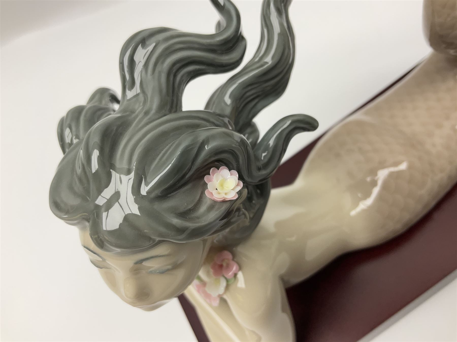 Lladro Mermaid trio set, comprising Illusion no. 1413, Fantasy no.1414 and Mirage no. 1415, all with wooden bases, largest H20cm