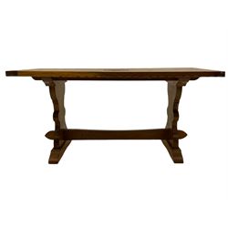 'Woodpeckerman' - Yorkshire oak rectangular coffee table by Stan Dodds, carved central rose, stretcher base, carved Woodpecker motif to the leg 