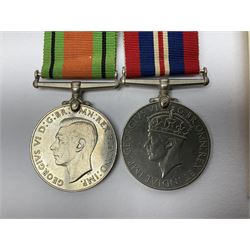 Twelve WW2 medals comprising four 1939-1945 war medals, four Defence medals, three 1939-1945 Stars and Africa Star; all with ribbons; some as groups in two issue boxes with slips