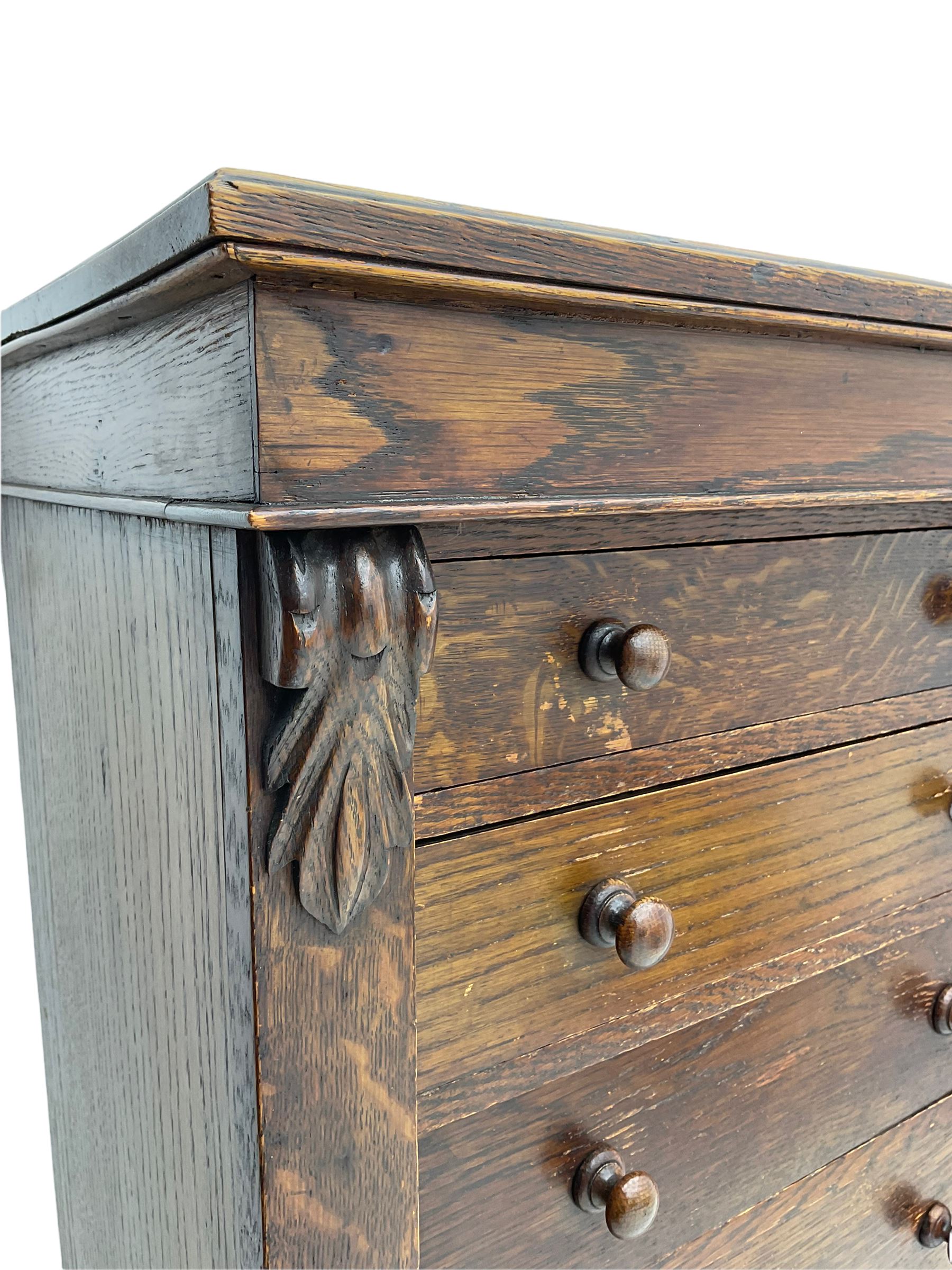 Victorian oak Wellington chest, fitted with seven drawers, lockable hinged side return