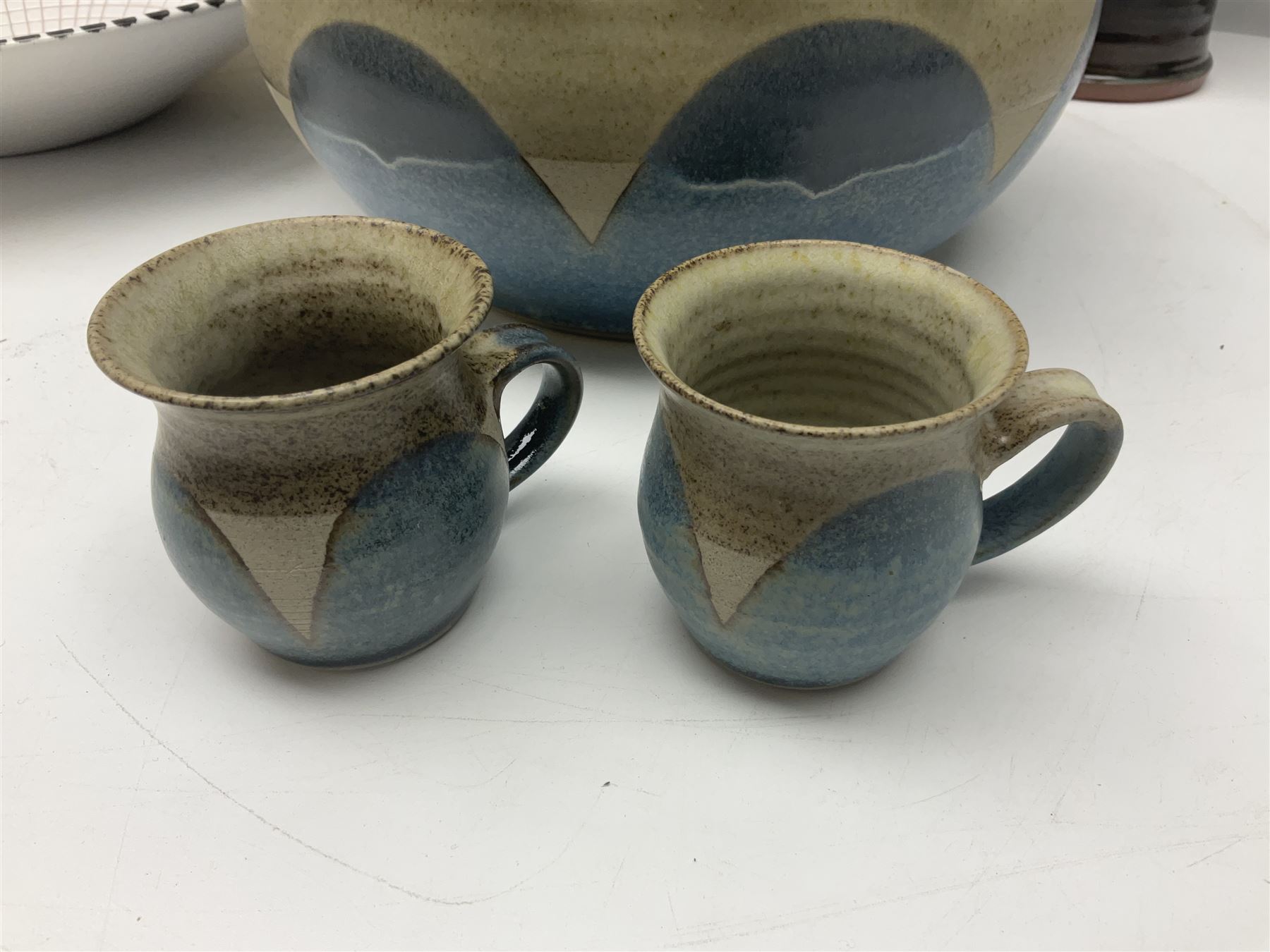 Collection of studio pottery, including Punch set with eight cups, two Paul Murray jugs, dishes, etc 