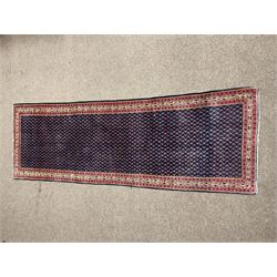 Persian Araak runner rug, the blue field decorated with repeating boteh motifs, repeating border with stylised and geometric design