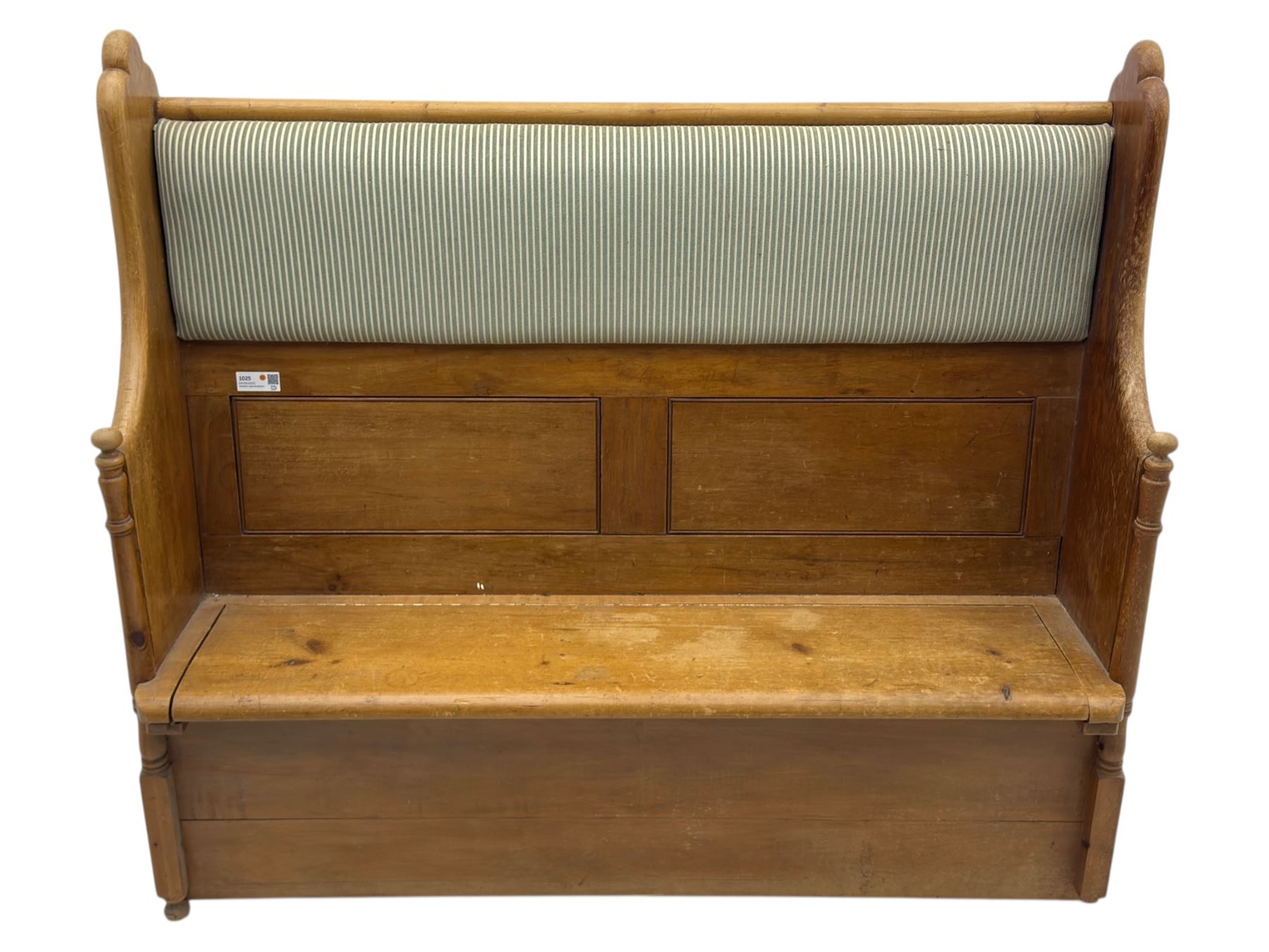 Early 20th century waxed pine pew, inset upholstered striped back panel with hinged box seat enclosing storage, shaped arms and turned supports