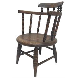 19th century child's spindle back armchair, curved cresting rail over bow arms on spindle supports, circular seat on ring turned supports united by turned stretchers 