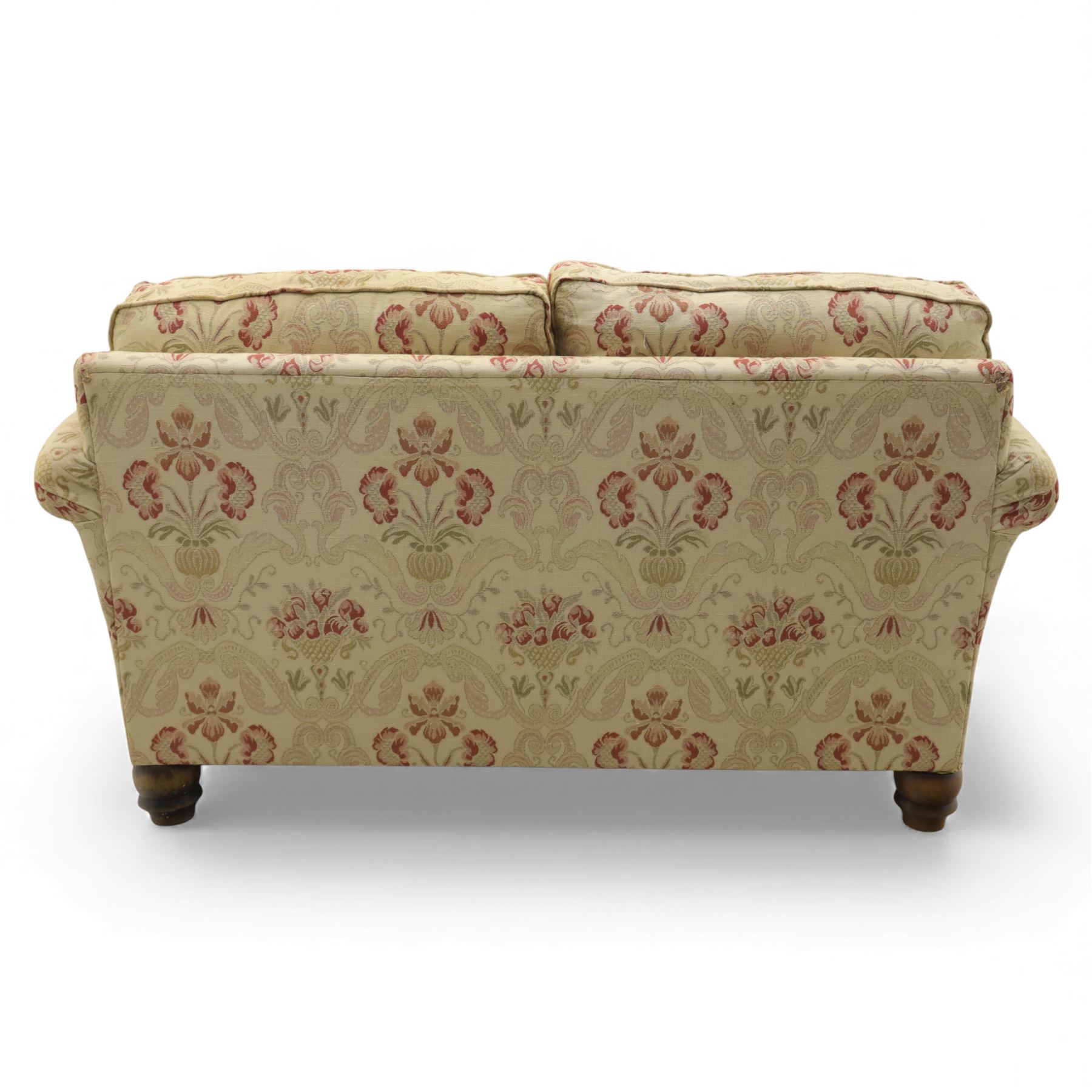 Late 20th century two seat sofa upholstered in floral beige and red fabric, turned supports 