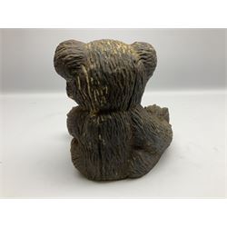 19th century cast iron door stop, modelled as a seated toy bear, with remnants of painted finish, H22.5cm