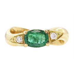 14ct gold emerald and diamond three stone ring, oval cut emerald with a round brilliant cu...