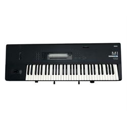 Korg M1 keyboard synthesiser, 61 velocity-sensitive keys with integrated multi-effects and eight-track sequencer, mounted on an adjustable black tubular X-frame stand with rubber end caps