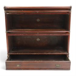 Globe Wernicke - early 20th century mahogany two-tier stacking library bookcase, fitted with glazed up-and-over doors, two drawers to the plinth base; together with a similar single-tier example (W87cm D27cm H54cm)