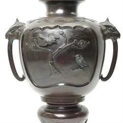 Japanese late Meiji period bronze koro and cover, surmounted by an eagle finial and with bird decoration in high relief to each side, twin elephant trunk handles, bearing indistinct character signature to one side, H82cm