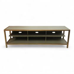 Contemporary low television stand, brass-effect metal frame enclosing six open oak veneere...