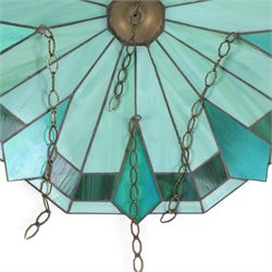 Pair of Tiffany style green stained glass shades with geomatic design, D50cm