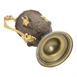 Pair of bronzed and gilt ewers in the Neo-Classical taste, each of typical form with figural detailed and mounted scroll handle surmounted by a winged figure, the bodies cast with scrolling strapwork, flower heads and acanthus leaves, and further detailed with applied gilt classical figures to oval recesses, upon a knopped stem and spreading circular foot with conforming cast detail, H28cm